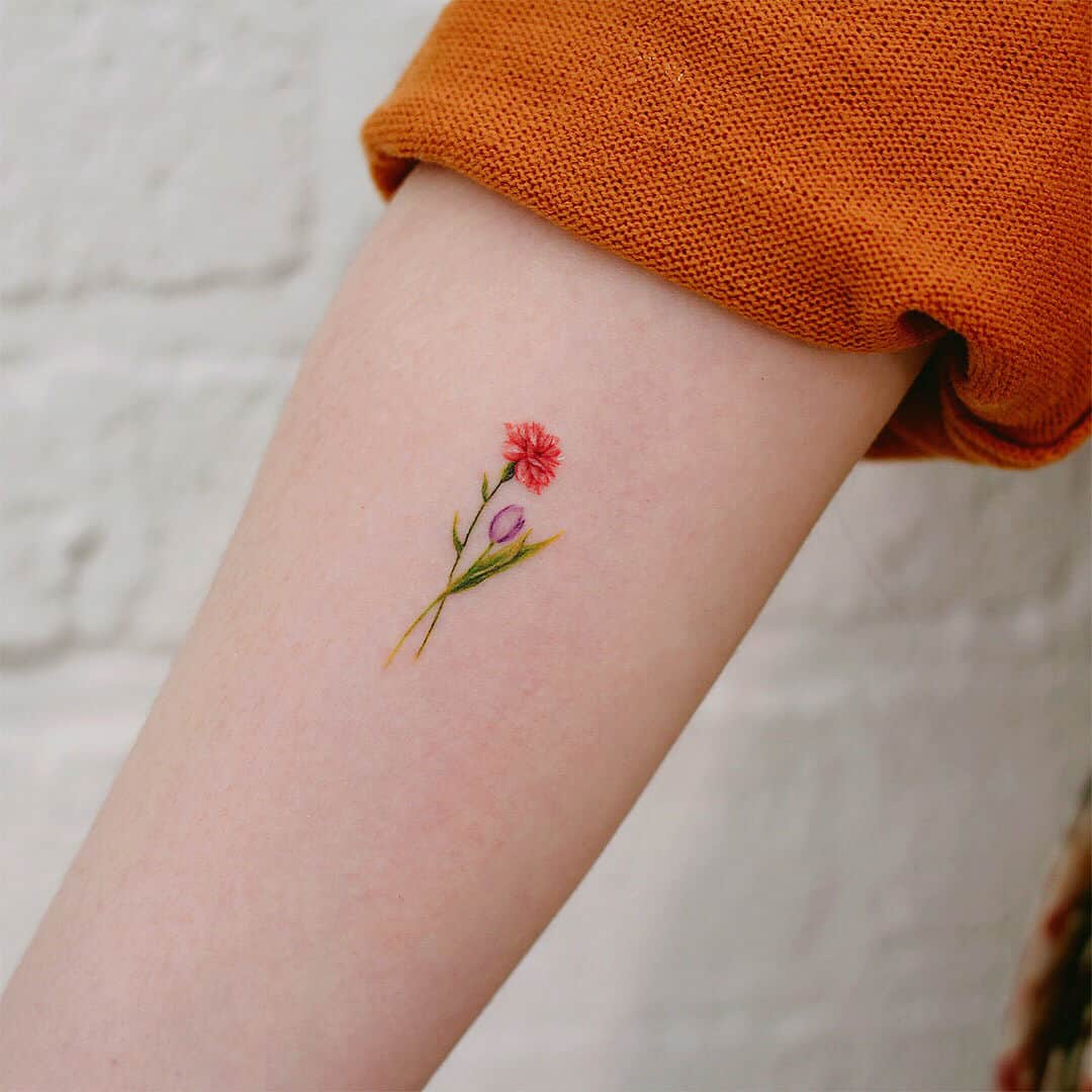 Tattoo uploaded by Hannah  Marigold and carnation tattoos  Tattoodo