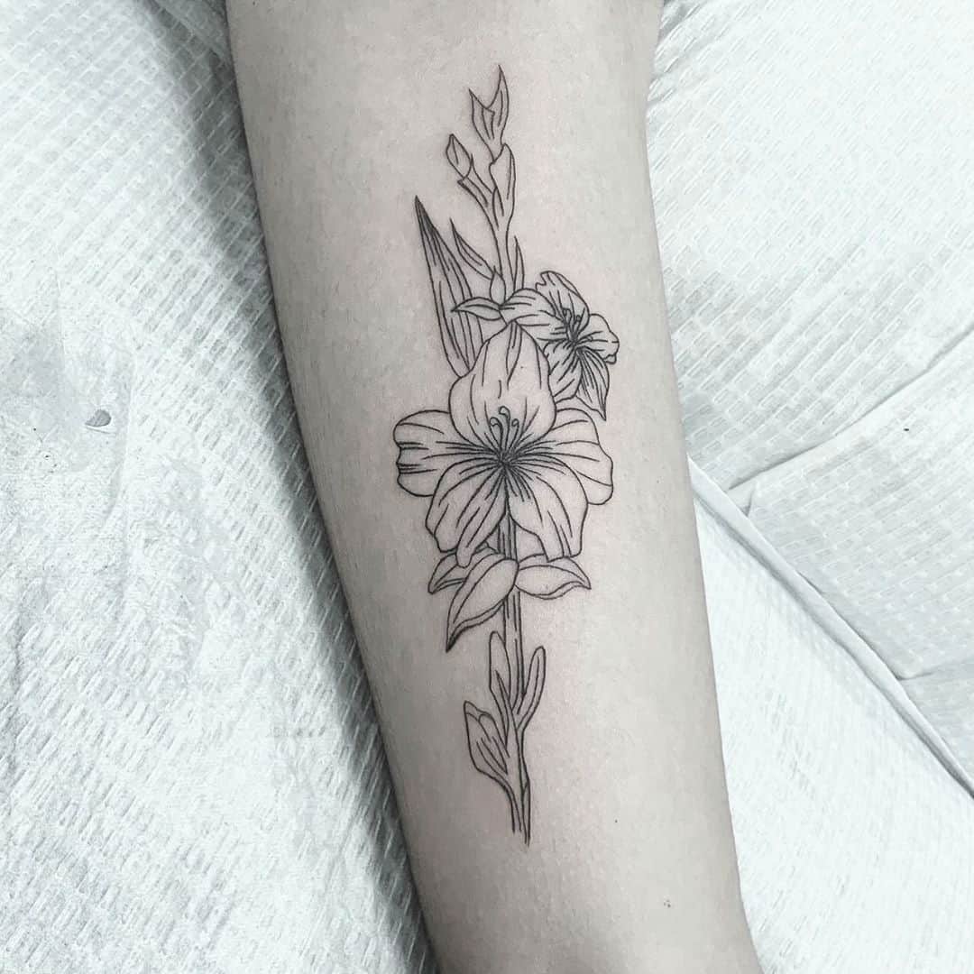 Tattoo uploaded by Isaiah Leyva • Gladiolus bunch on the spine, follow me  on Instagram @ileyva_sfc • Tattoodo