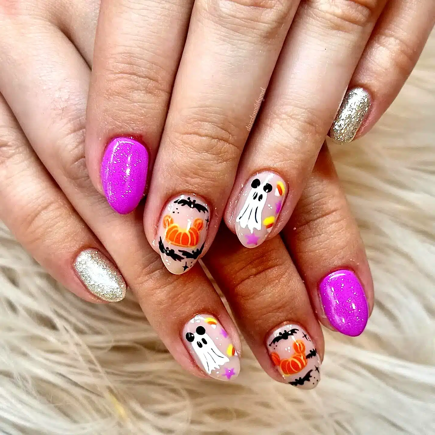 Adorable Almond-Shaped Halloween Nails for Kids with Pink and Glittery Gold Ghost and Pumpkin Designs