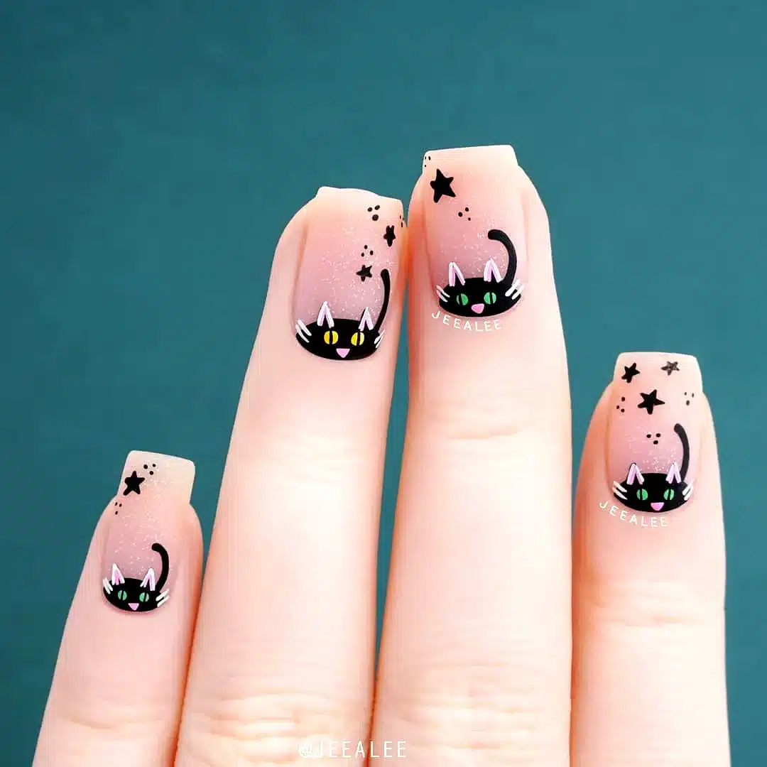 Adorable Rounded Black Cat Nails with Nude Gradient and Starry Nail Art