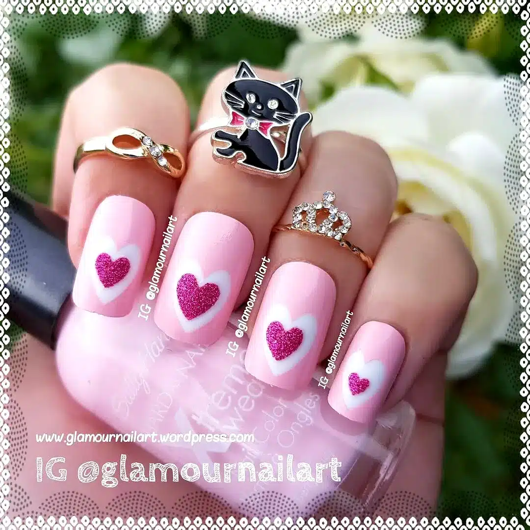 Adorable Square Pink Heart Nails with Whimsical Glittery Accents and a Cute Cat Charm