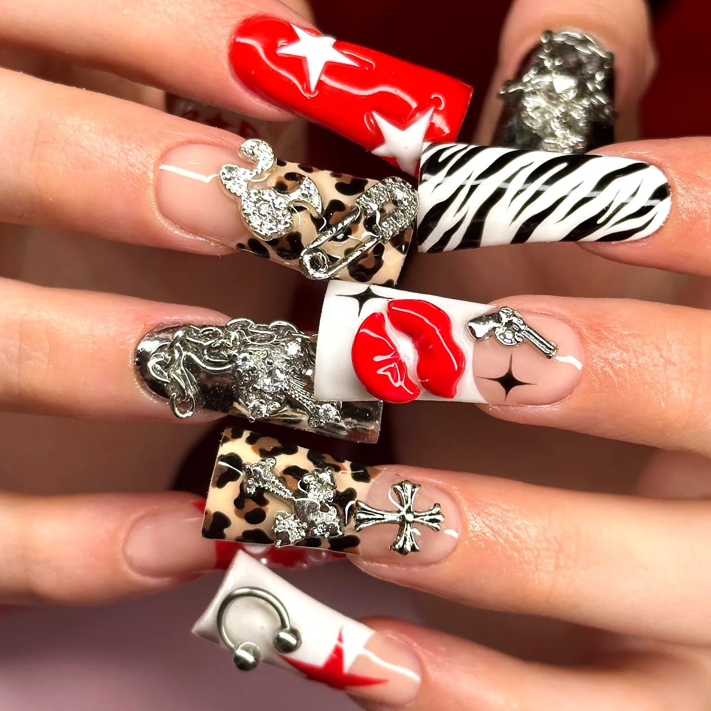 Bold Zebra Print Nails on Elongated Coffin Shape with Vibrant Red Black and Beige Patterns and Edgy Metallic Elements