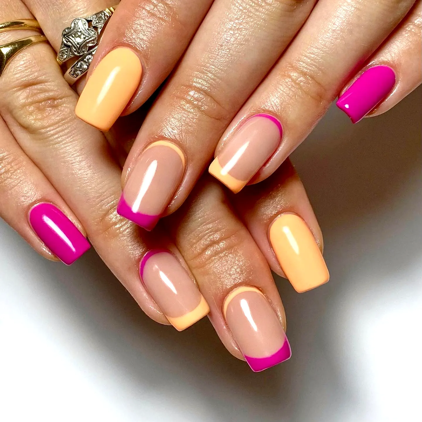Charming Almond and Square Tropical Nail Designs with Pastel Peach and Nude Colors and Vibrant Pink Tips