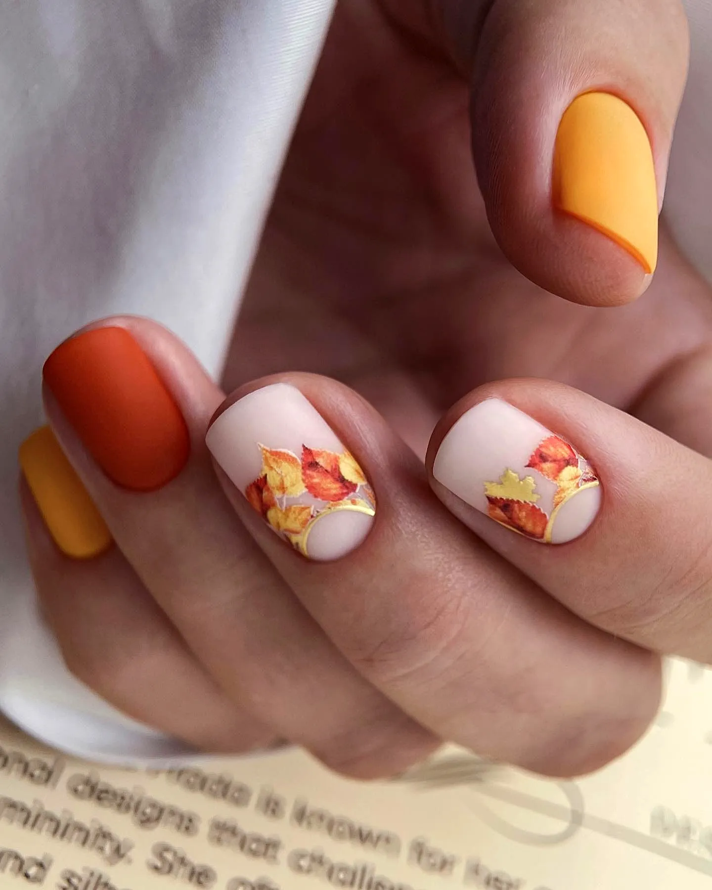 Charming Almond Fall Nail Designs with Warm Autumn Hues and Gold Leaf Accents