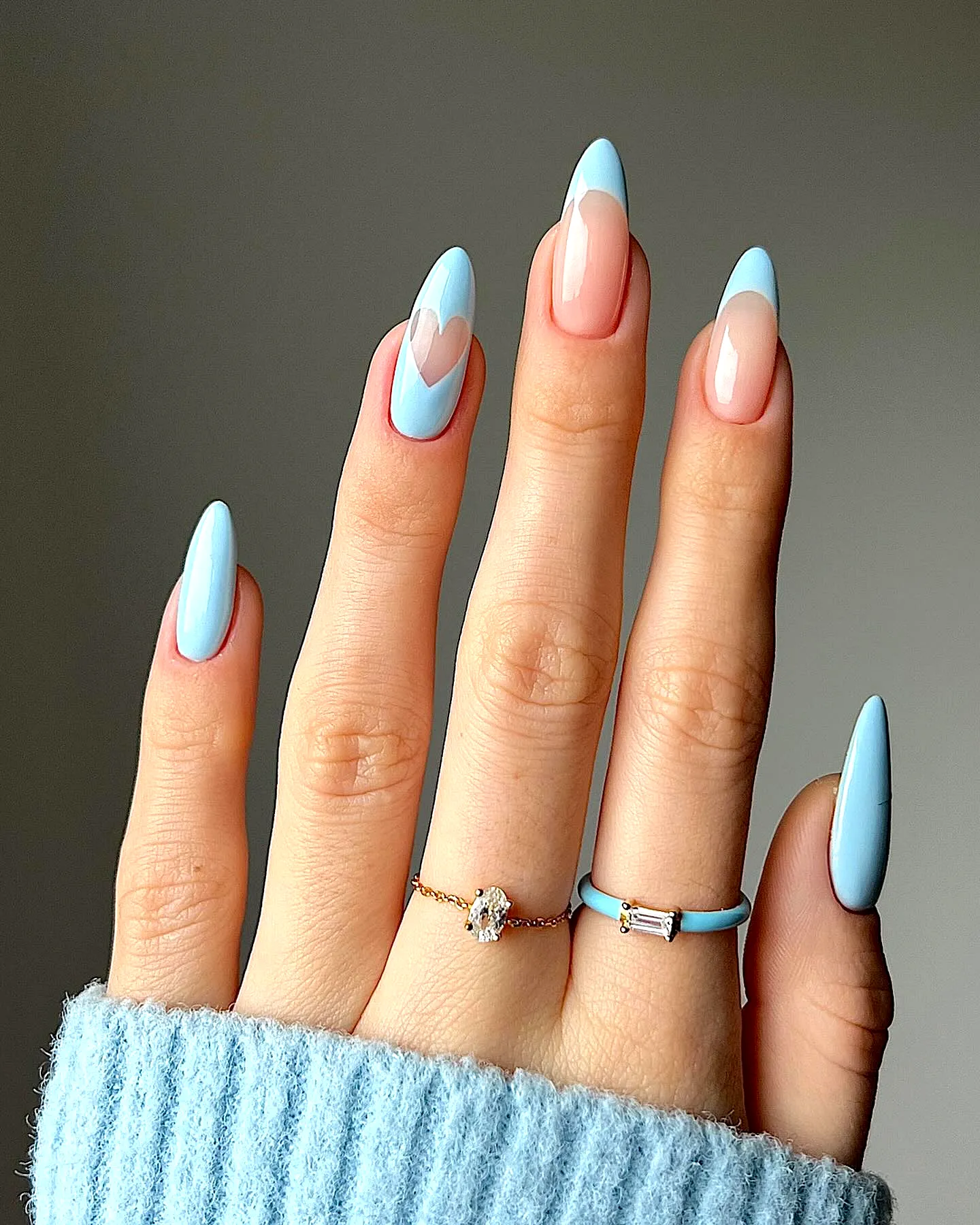 Charming Almond Shaped Baby Blue Nails with Heart Tips and Playful Design
