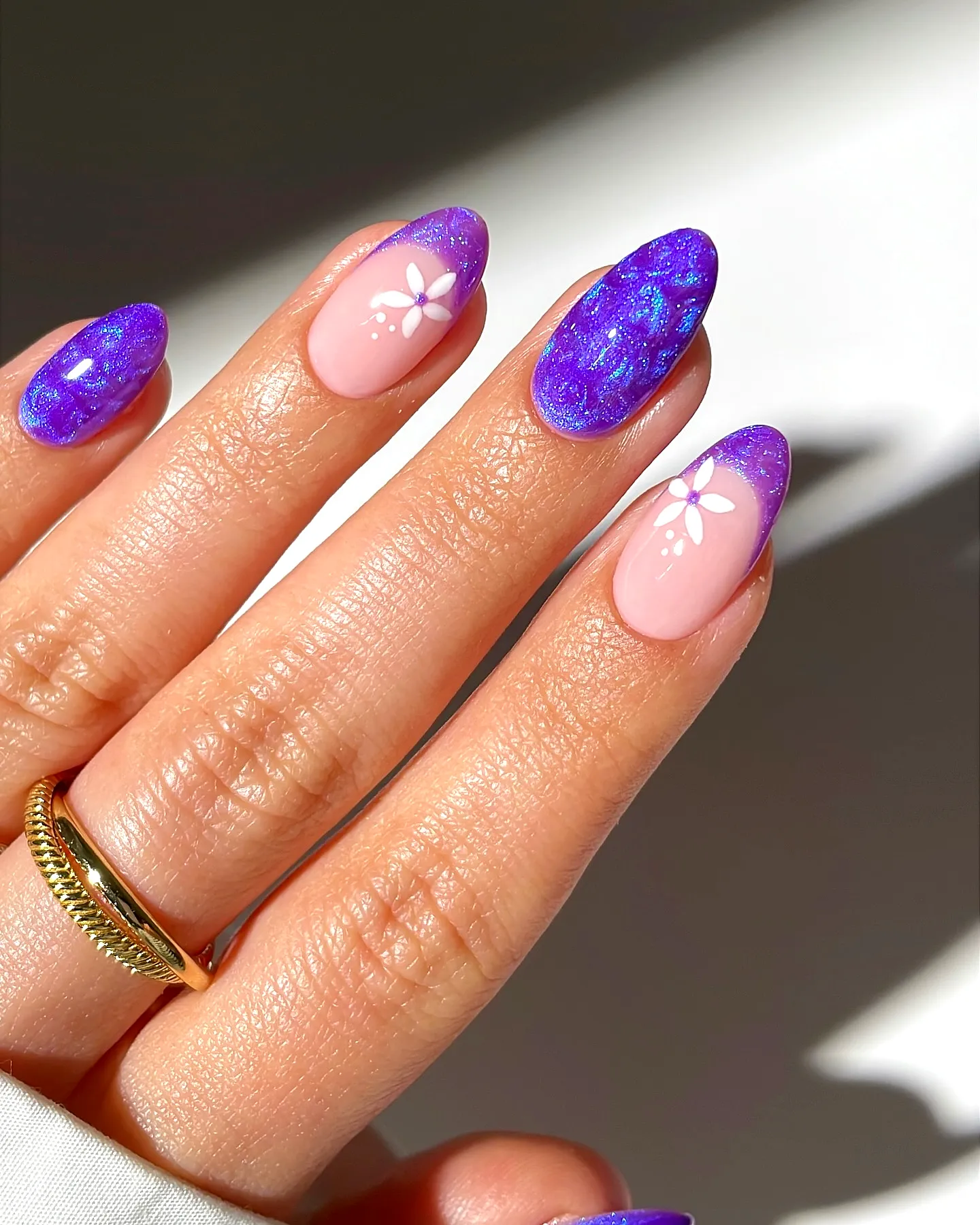Charming Almond Shaped Purple Spring Nails with Glitter and Floral Art