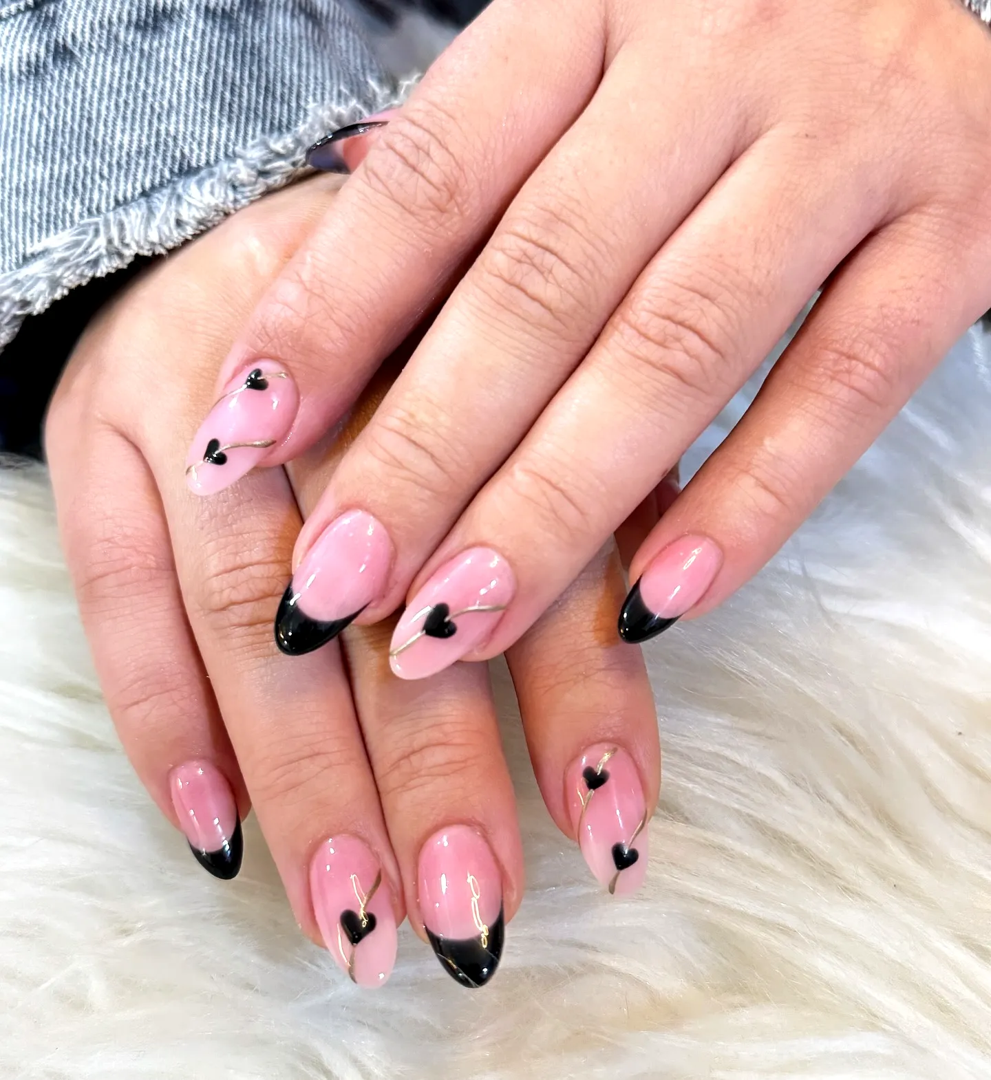 Charming Almond-Shaped Sheer Pink and Black Tips Nail Design with Heart Accents for Ring Finger Heart Nails