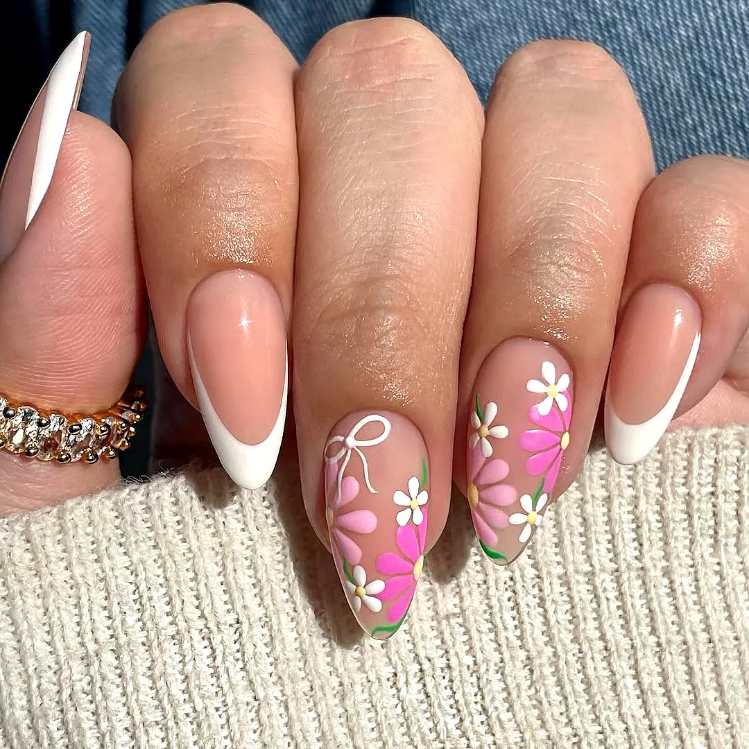 Charming Almond Shaped Tropical Nail Designs with Soft Nude Base and Floral Accents