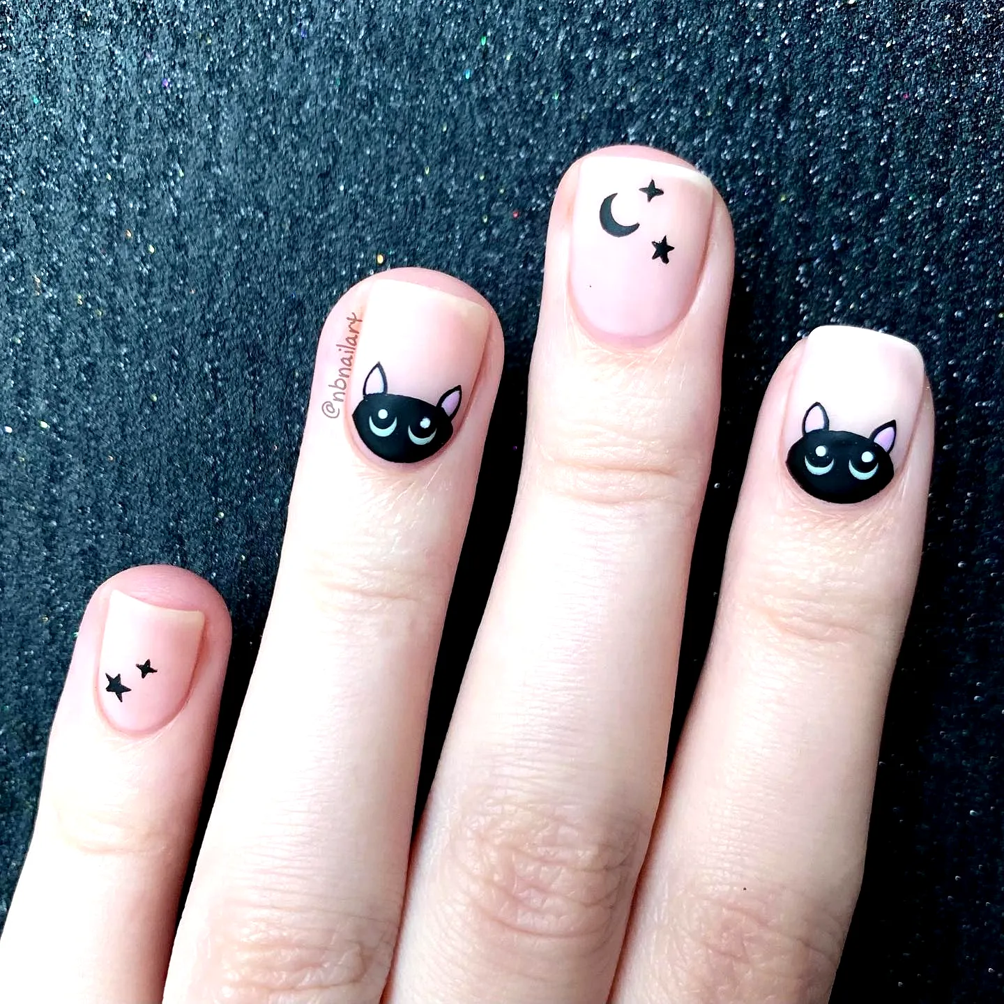 Charming Square Black Cat Nails with Soft Nude Base and Celestial Nail Art Elements