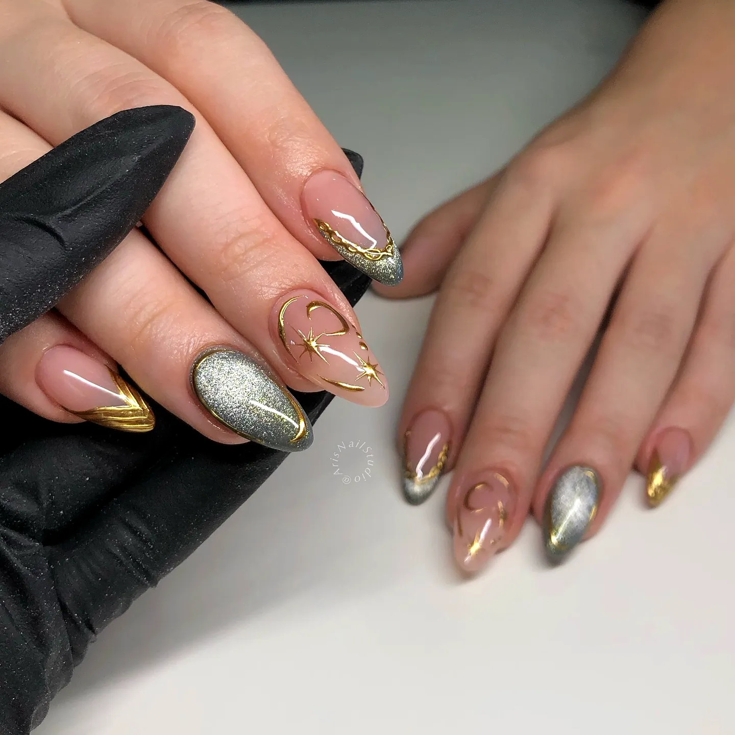 Chic Almond Chrome Nails with Nude Pink Base and Shimmering Gold and Silver Accents