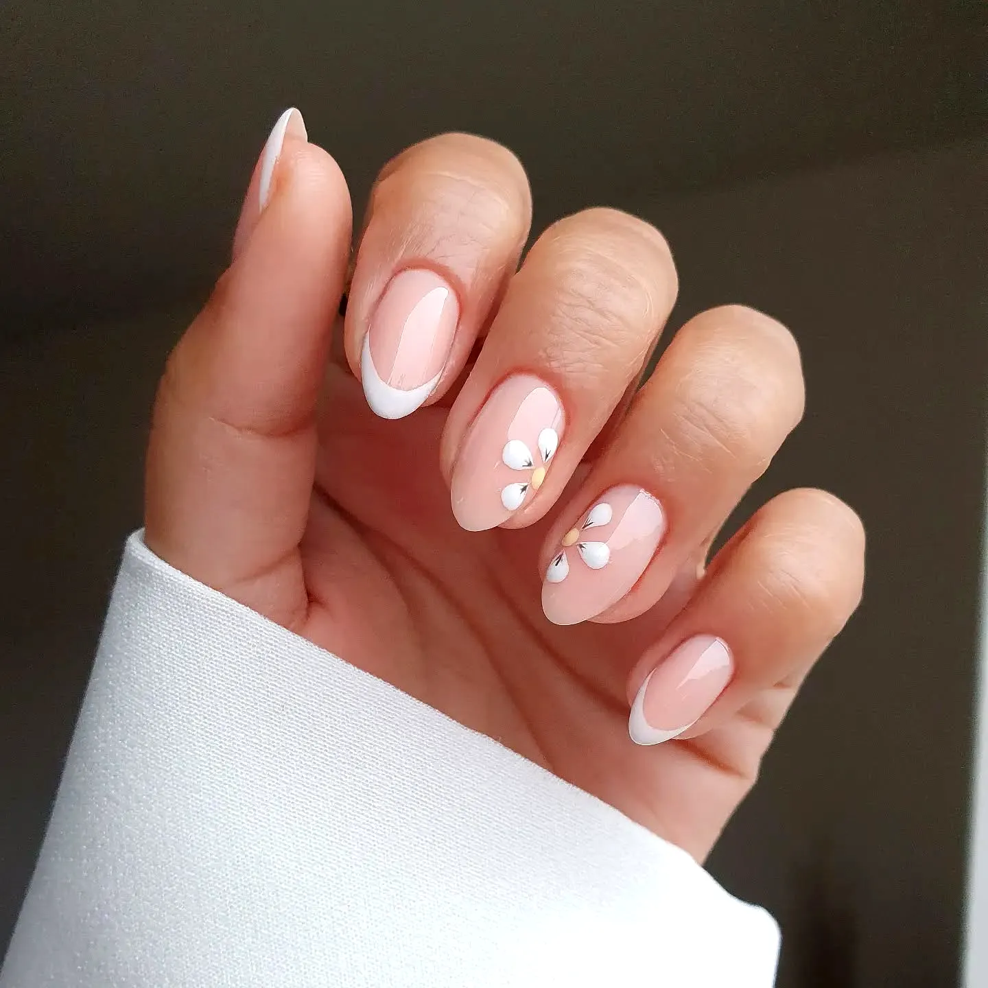 Chic Almond Daisy Nail Designs with Nude Base and Elegant French Tips