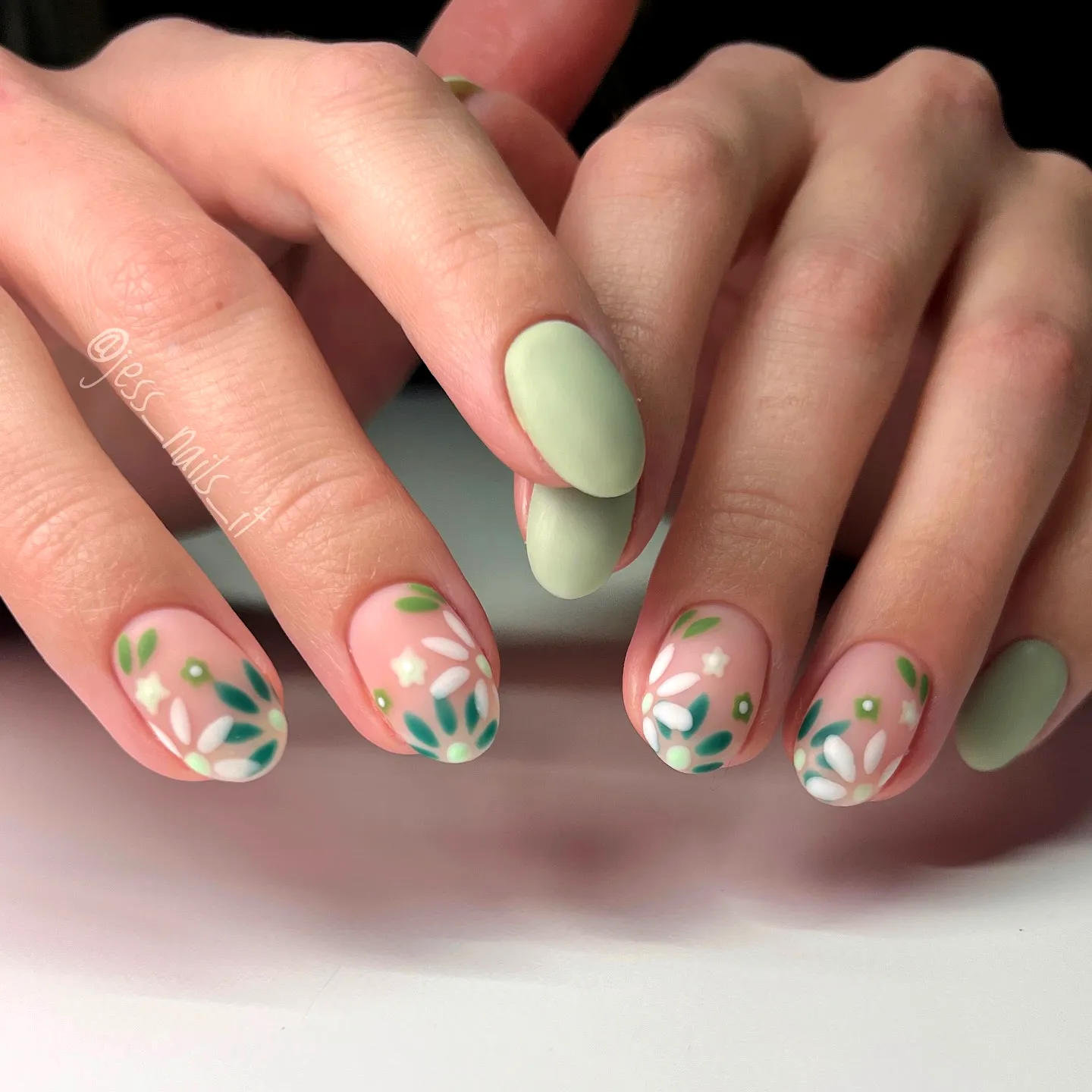 Chic Almond Green Nails with Delicate Floral Art in Soft Mint and Pastel Shades