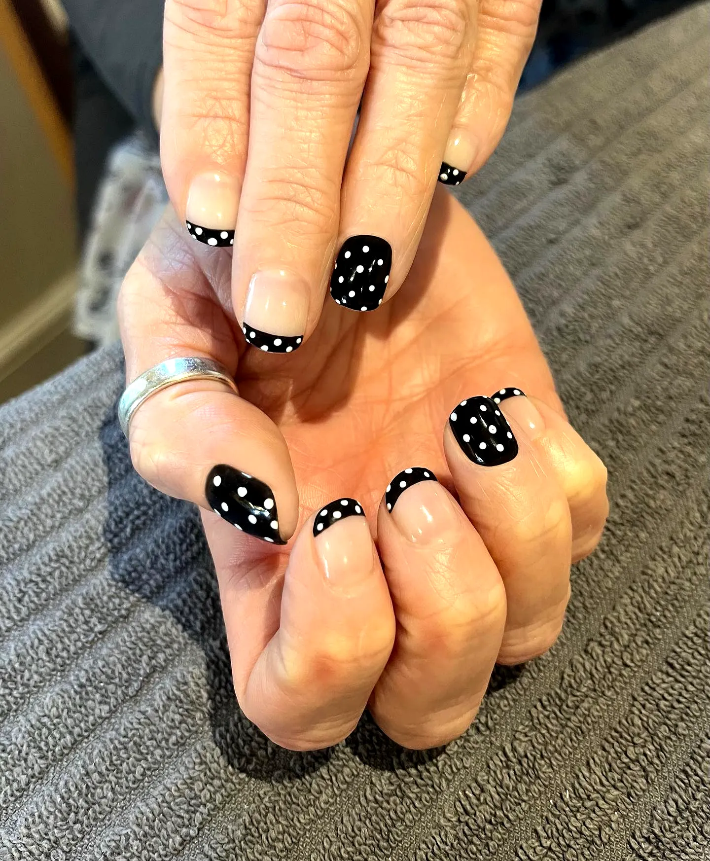 Chic Almond Shaped Black and White Polka Dot Nails with Classic French Tips