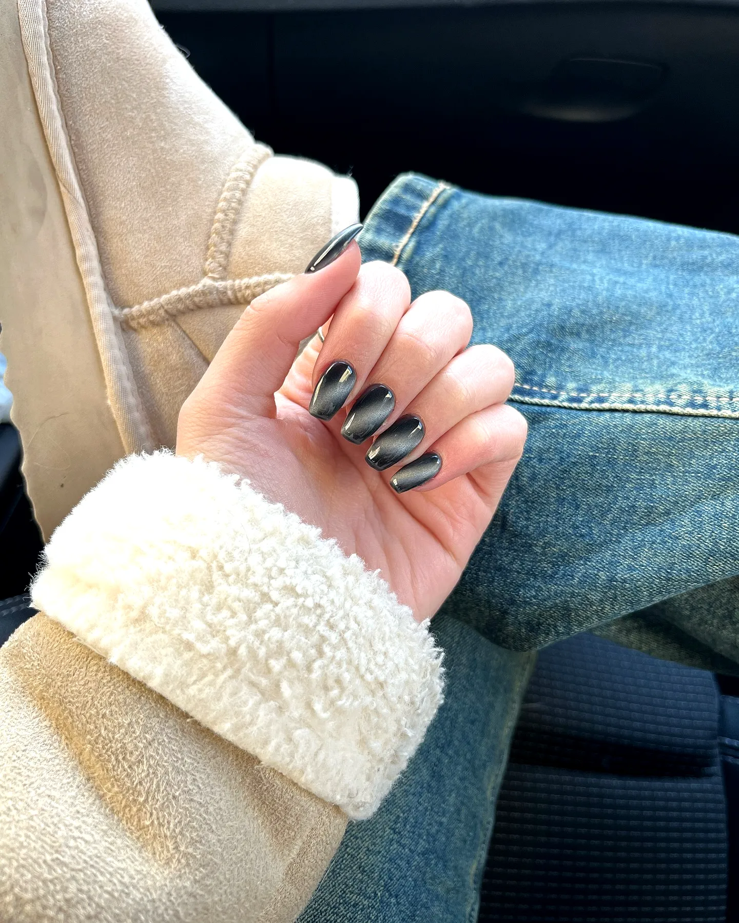 Chic Almond-Shaped Gray Nails with Glossy Metallic Black Design