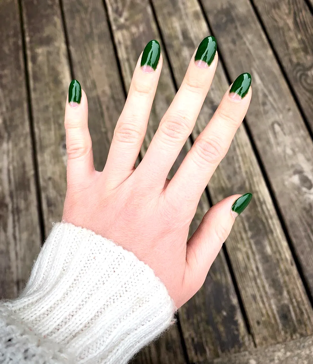 Chic Almond-Shaped Half-Moon Nails in Glossy Deep Green Minimalist Style