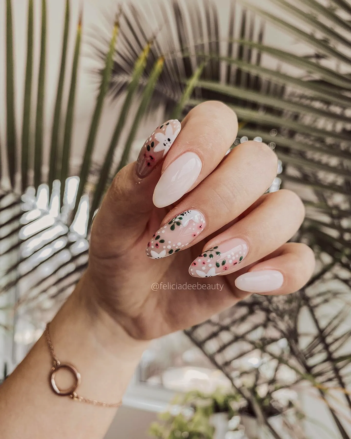 Chic Almond Tropical Nail Designs with Soft Pink and Bold Floral Patterns
