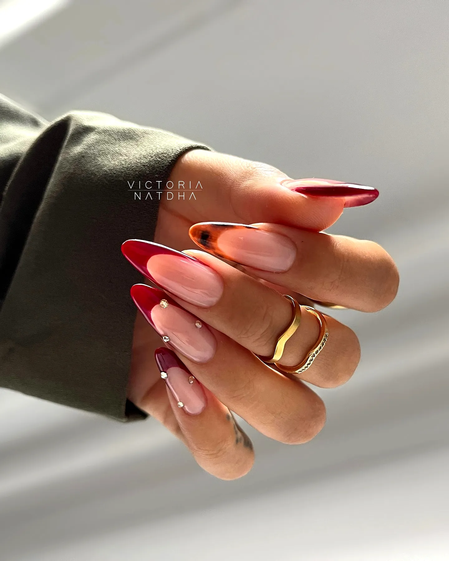 Chic Long Almond Red Nails with Elegant Gradient and Gold Accents