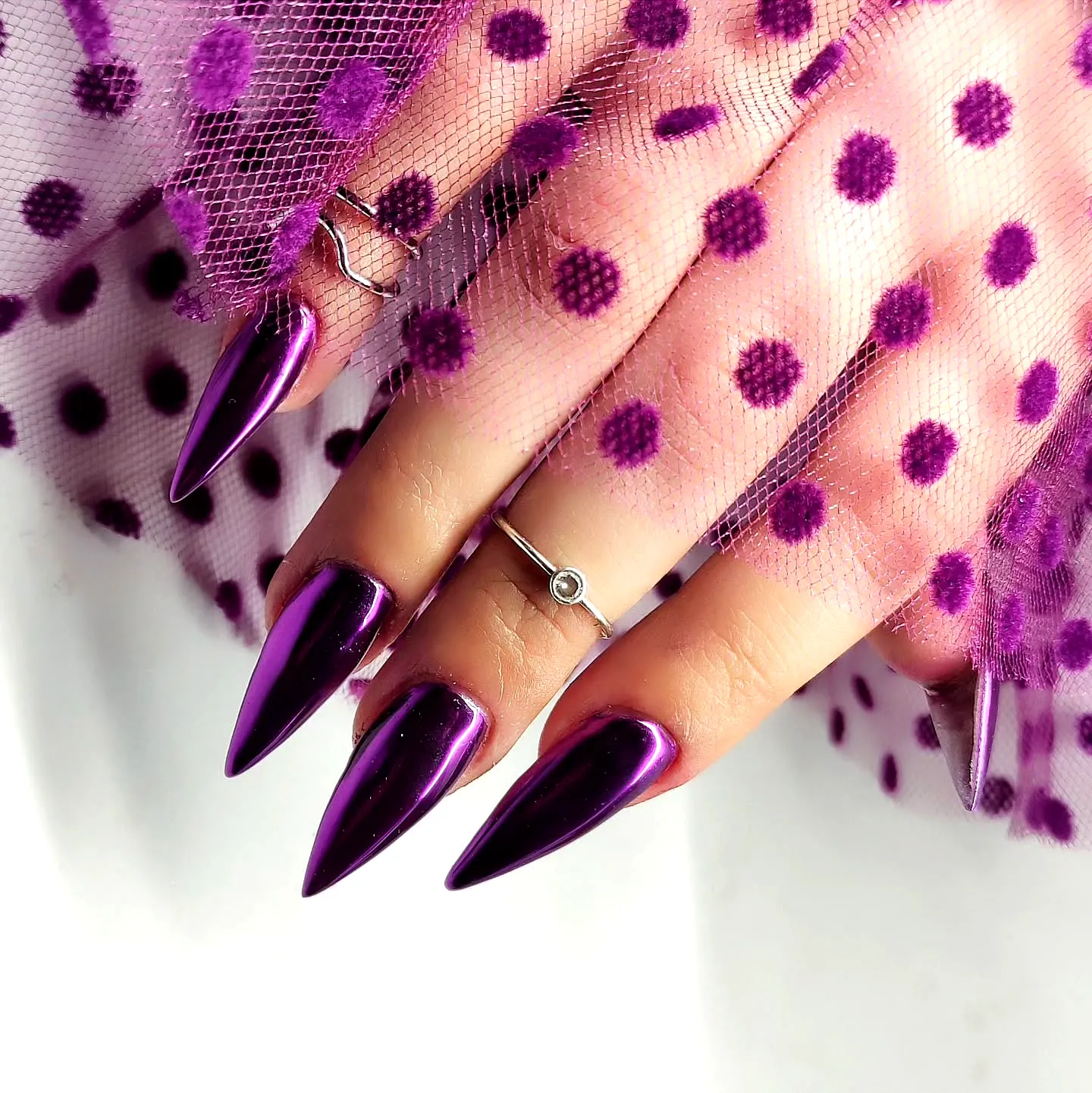 Chic Metallic Purple Stiletto Nails with Dotted Sheer Elegance