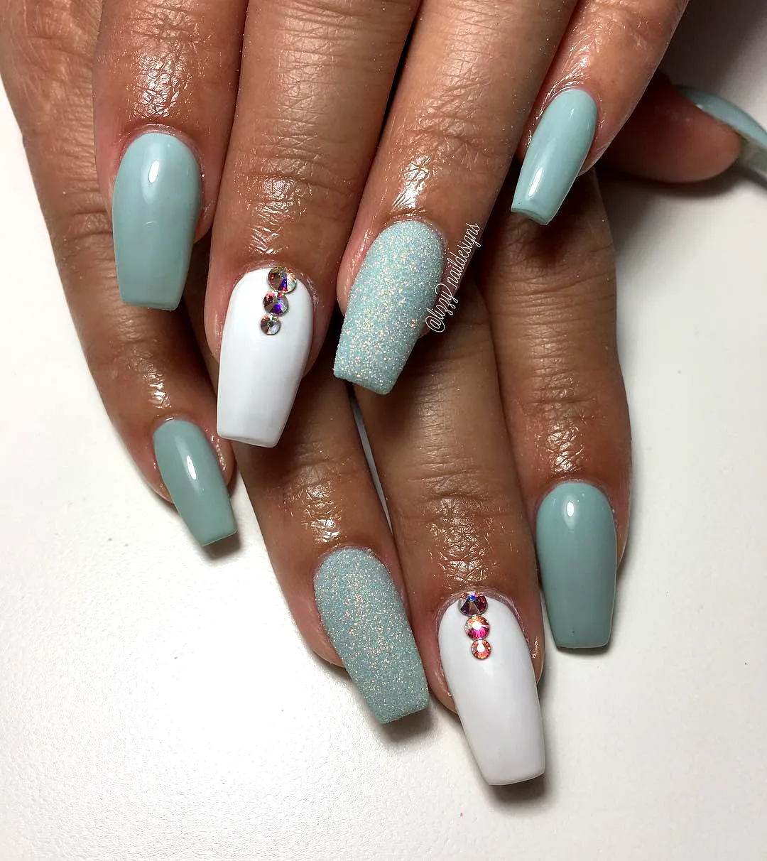 Chic Mint Green Nails with Elegant Shapes Glittery Accents and Rhinestone Details