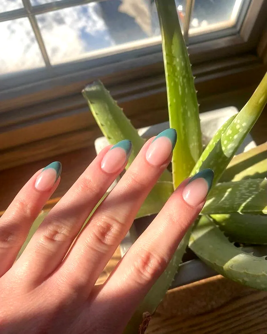 Chic olive green nails with a classic French tip design in striking teal on natural shapes