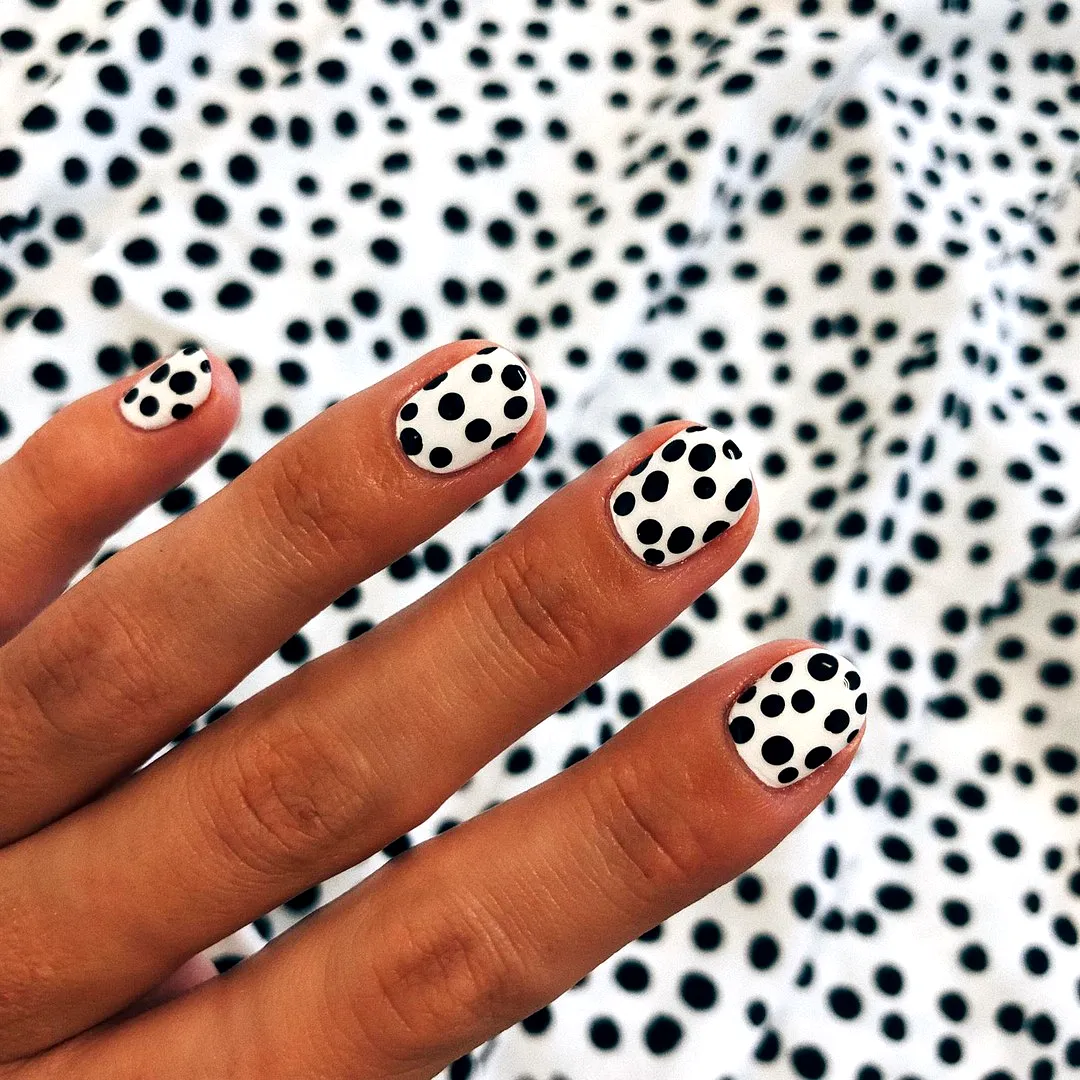 Chic Oval Black and White Polka Dot Nails with Playful Minimalistic Design