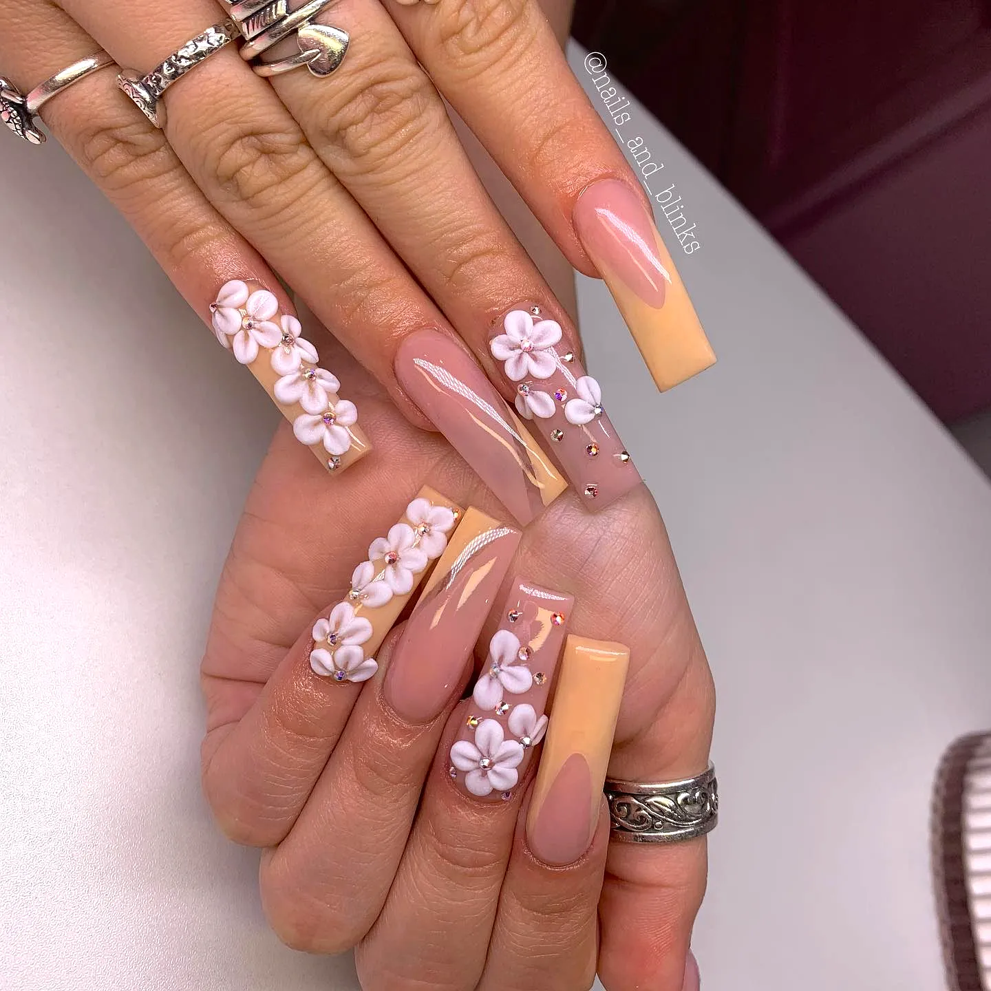 Chic Square Tropical Nail Designs in Soft Peach and Nude with 3D Floral Embellishments and Rhinestones