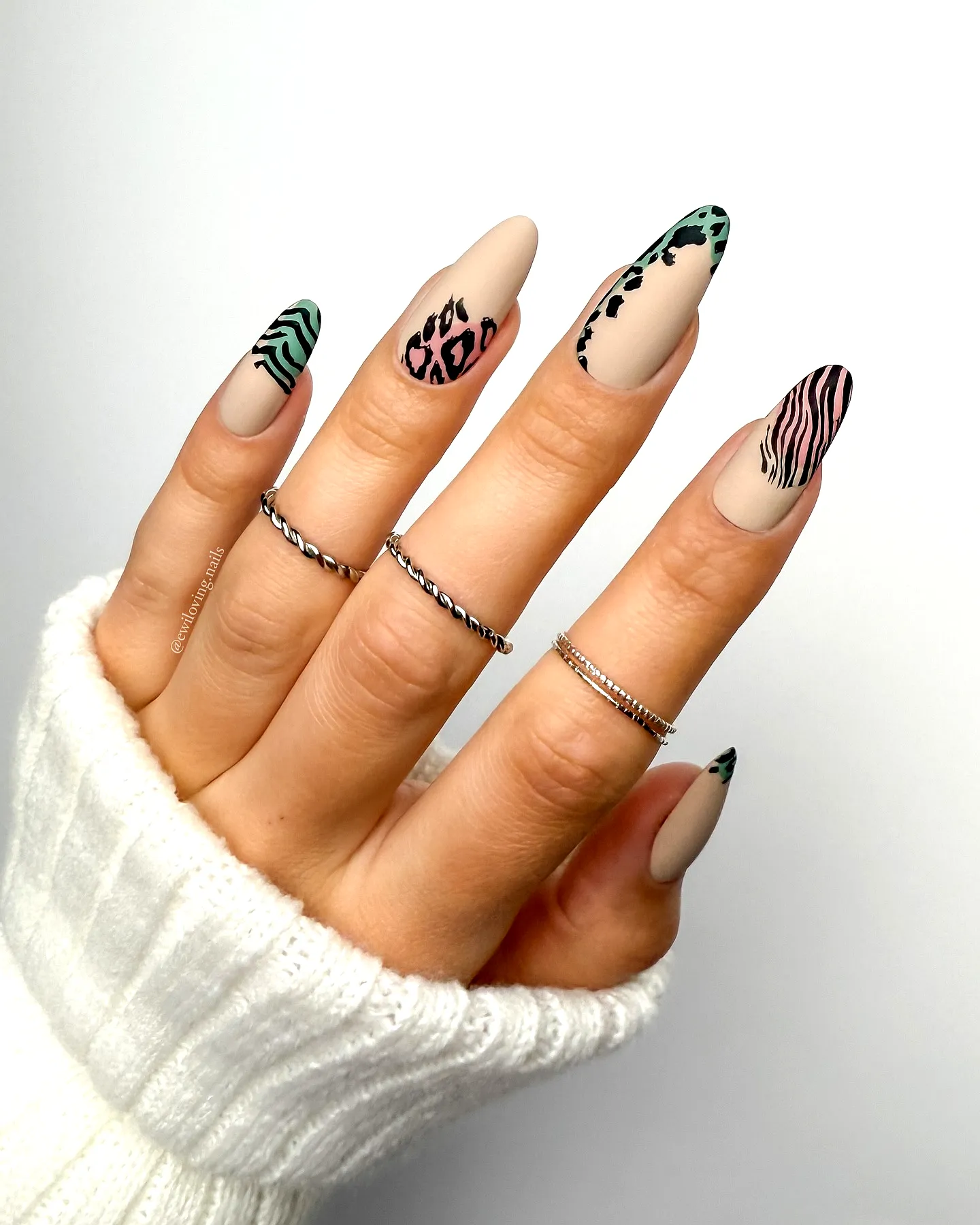 Chic Stiletto Animal Print Nails in Matte Beige with Abstract Patterns