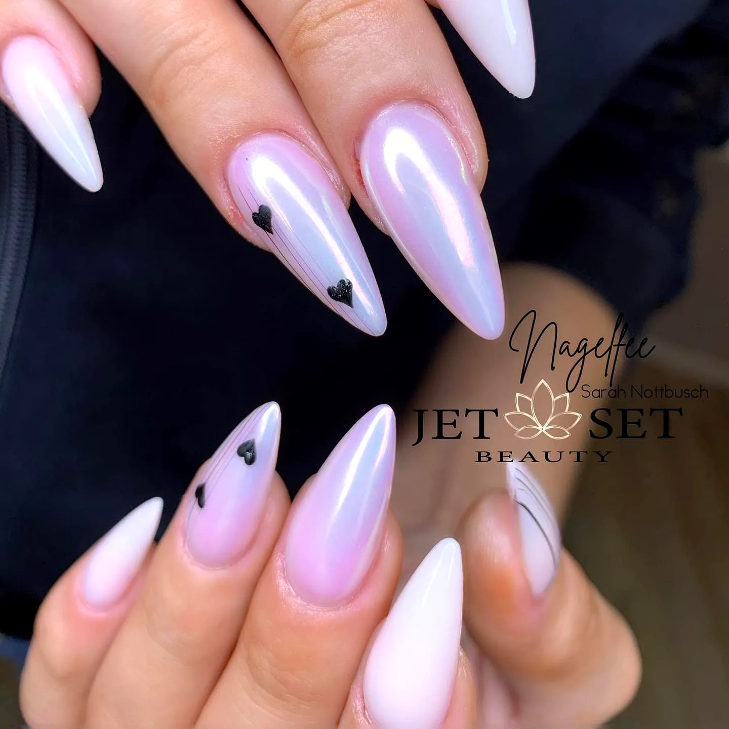 Chic Stiletto Aurora Nails with Glossy Iridescent Pink Hue and Delicate Heart Accents