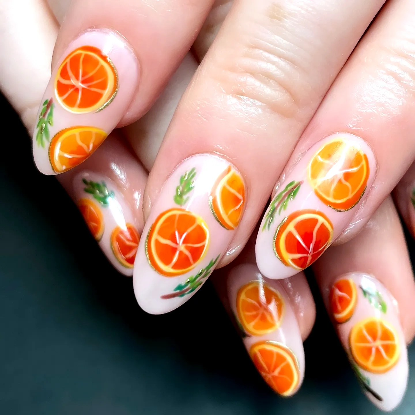 Cute Almond Orange Nails with Fruity Slice and Leaf Design for a Playful Summer Look