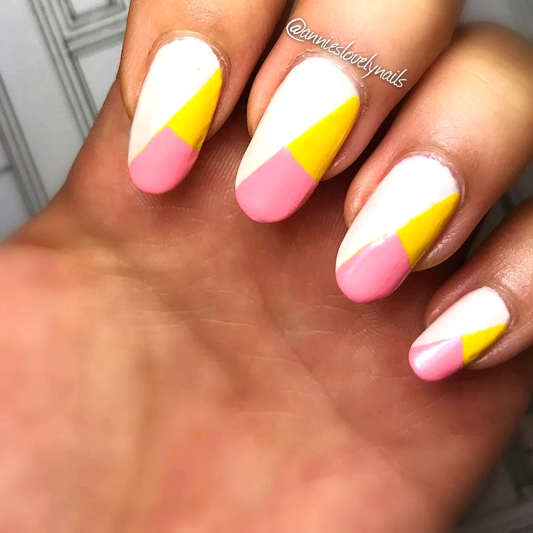 Cute Almond-Shaped Easter Nail Designs with Playful Pastel Color Blocking and Geometric Patterns