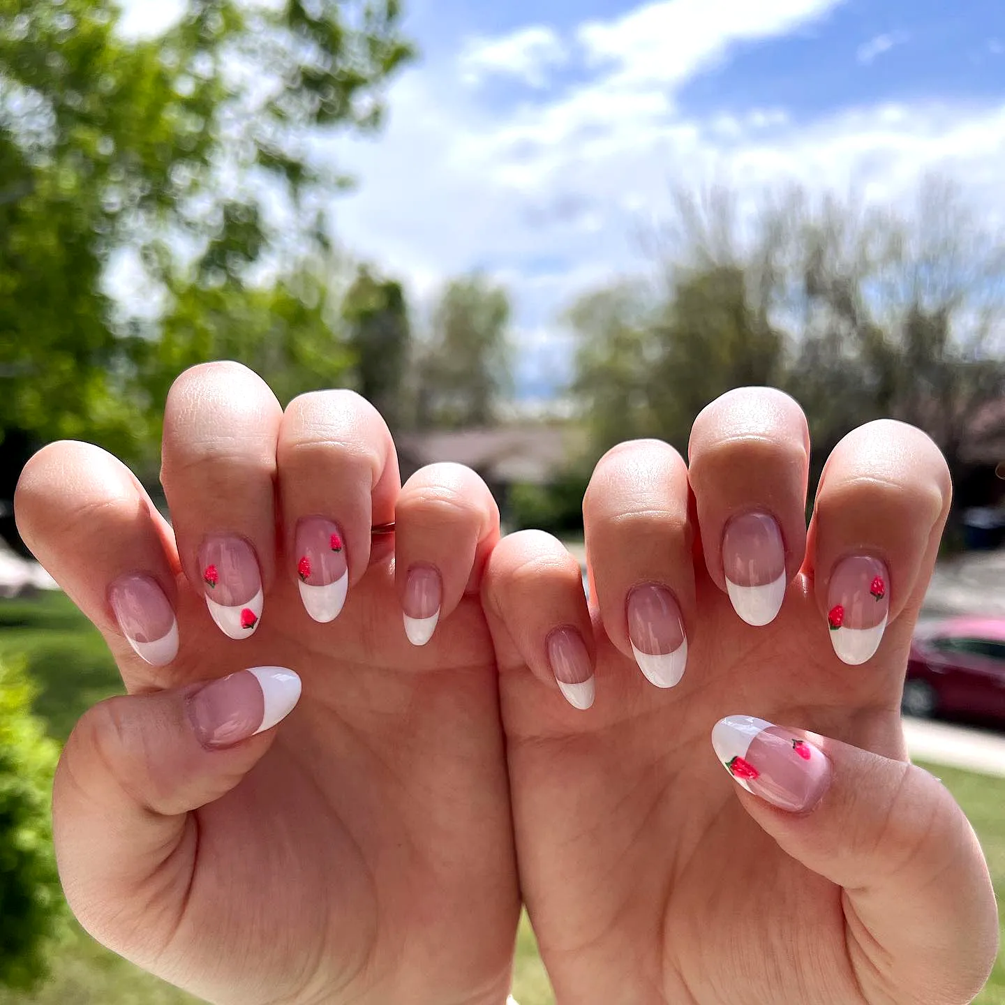 Cute almond shaped French tip fruit nail designs with red heart accents