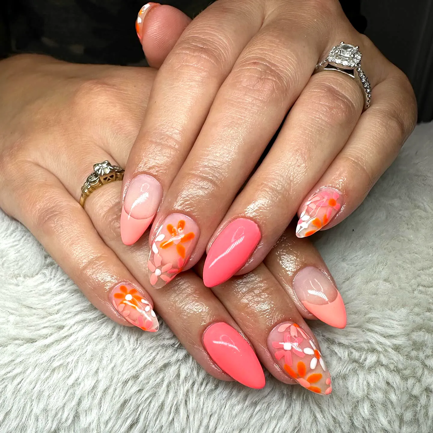 Cute Almond-Shaped Honeymoon Nails in Vibrant Coral Pink with Floral Accent Art