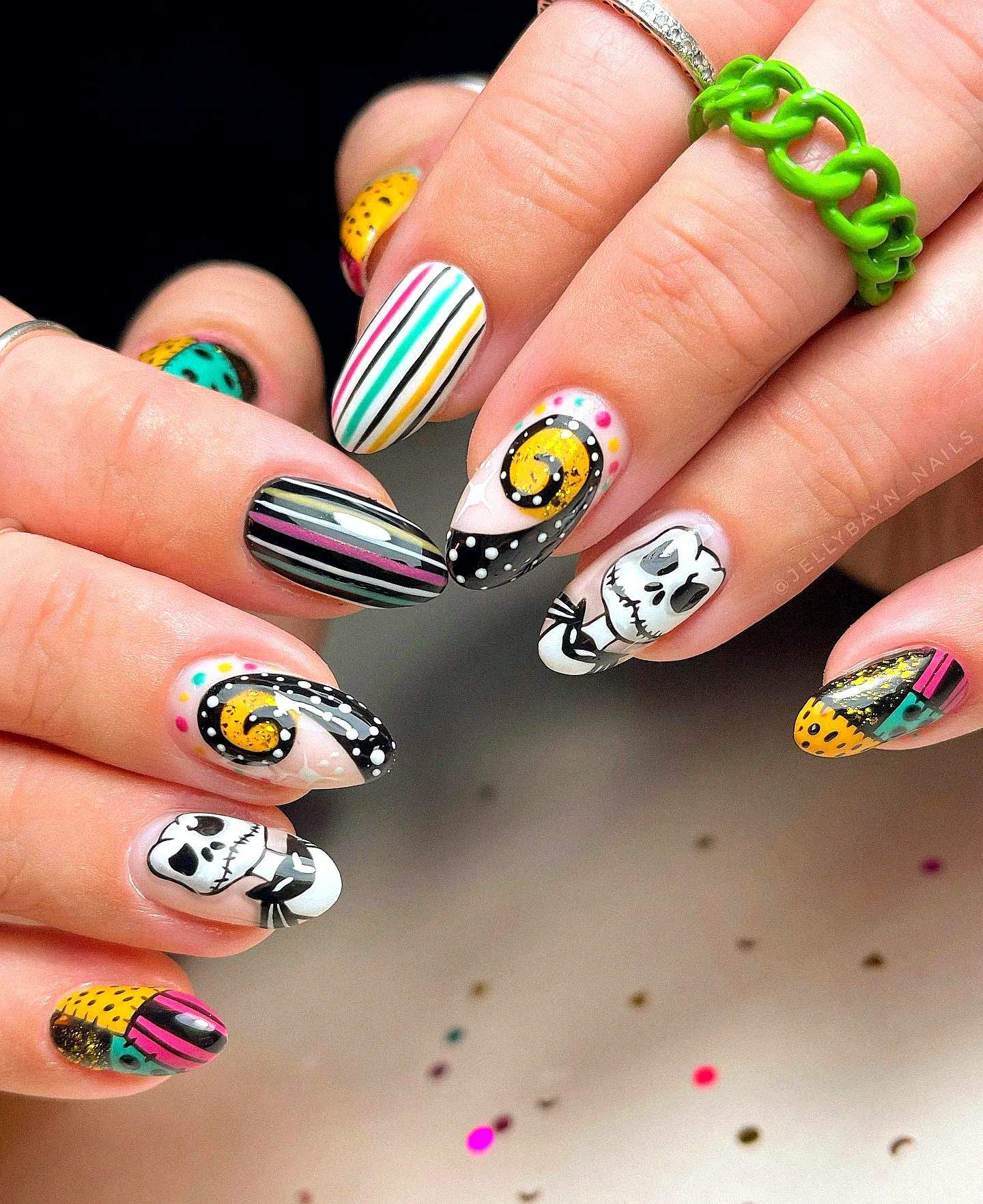 Cute Almond Shaped Nightmare Before Christmas Nails with Playful Patterns in Black Yellow and White