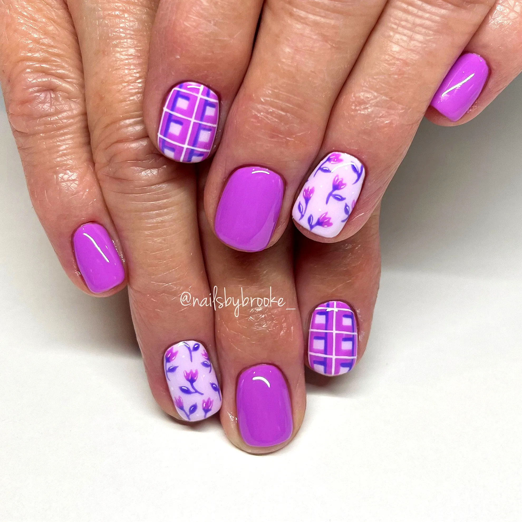 Cute Almond Shaped Purple Nails with Floral and Grid Pattern Nail Art