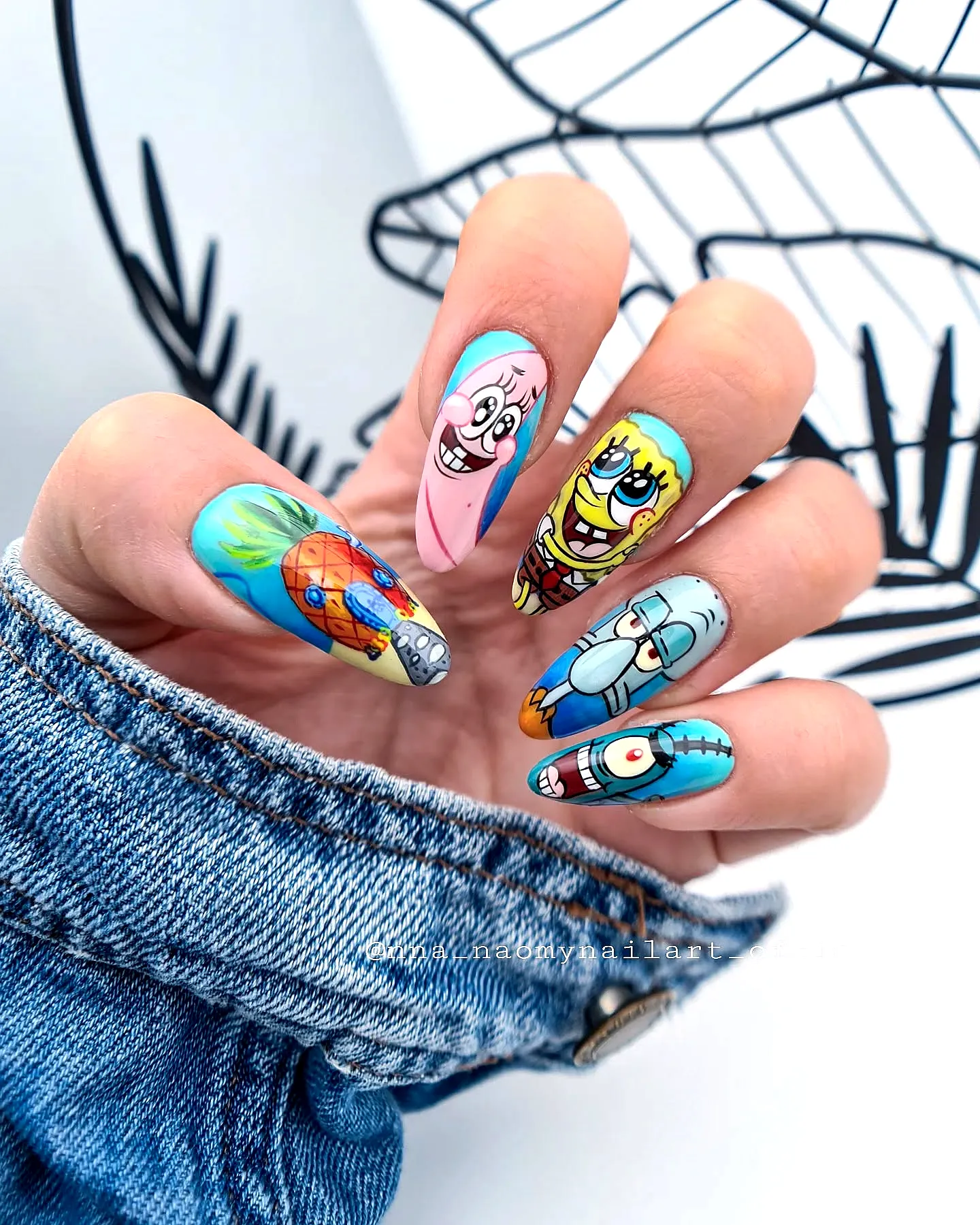 Cute Almond-Shaped Spongebob Nails in Vibrant Blue and Pink with Whimsical Cartoon Characters