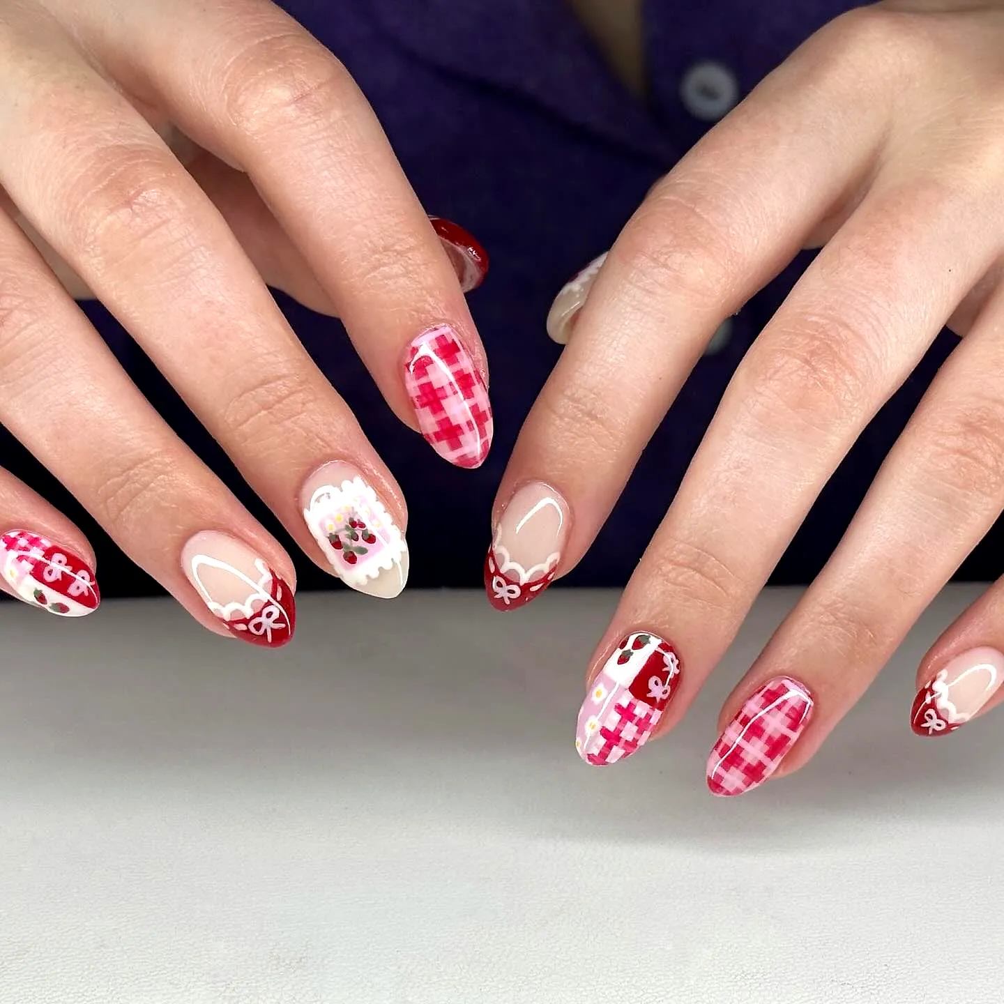 Cute Almond-Shaped Valentines Day Nails with Red Pink and White Plaid Patterns and Bow Accents
