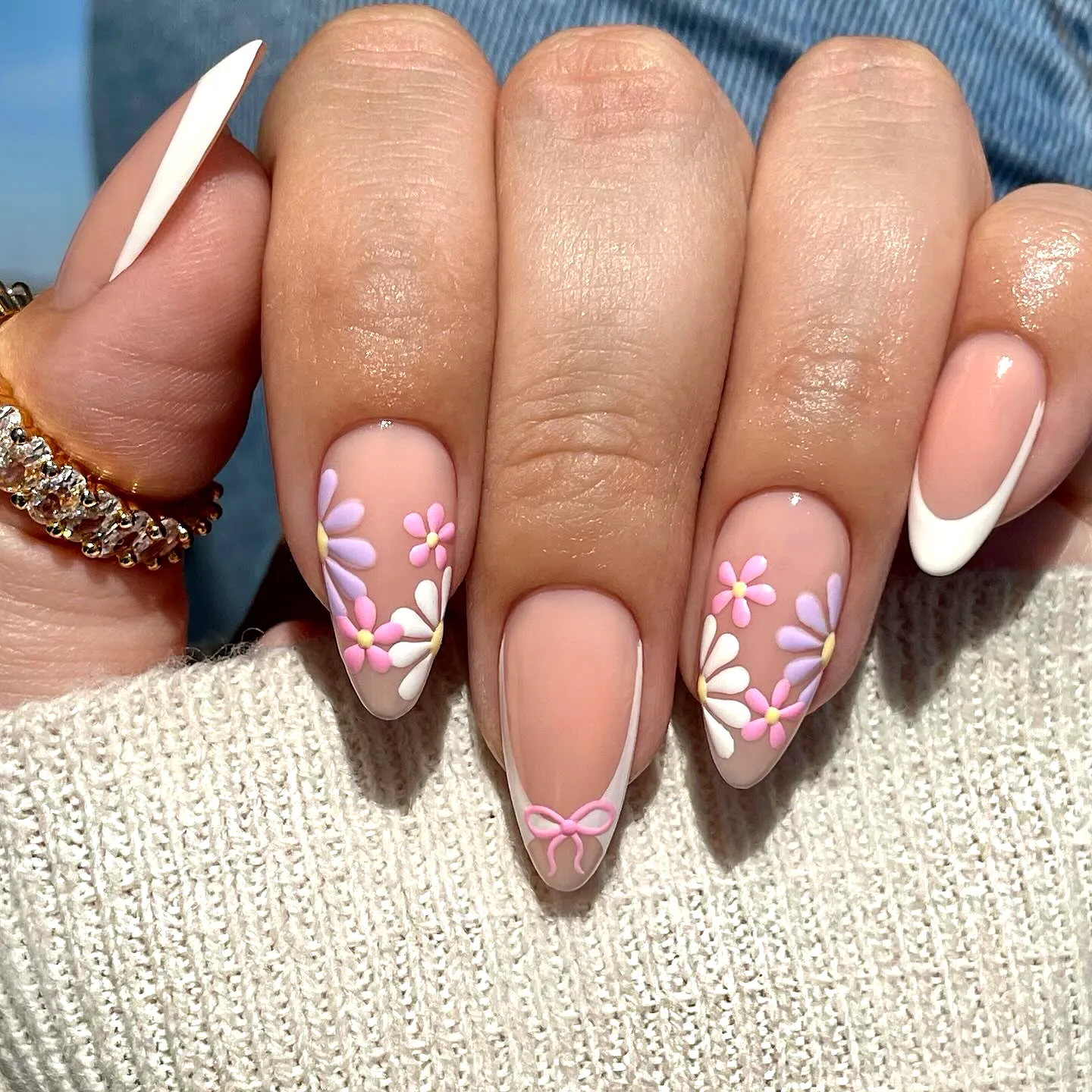 Cute Almond Spring Nails with Soft Nude Base Floral Patterns and French Tips