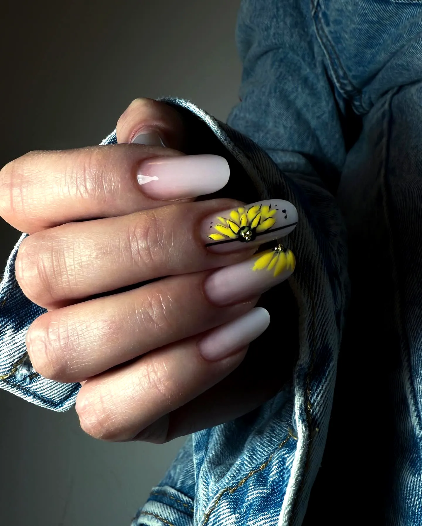 Cute long almond sunflower nail designs with vibrant daisy artwork and minimalist patterns