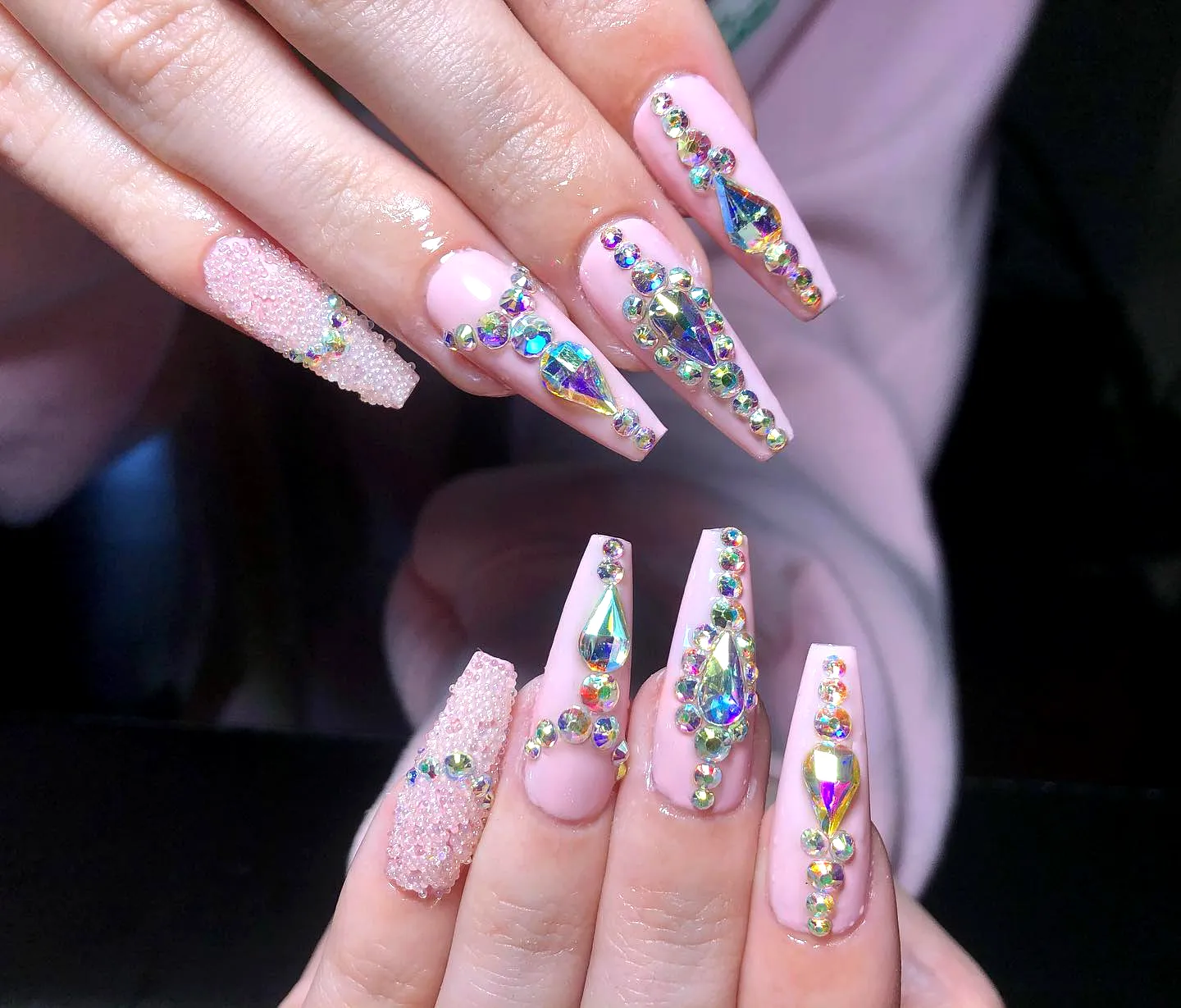 Cute Long Tapered Rhinestone Nail Designs with Soft Pink Base and Glamorous Textured Accents