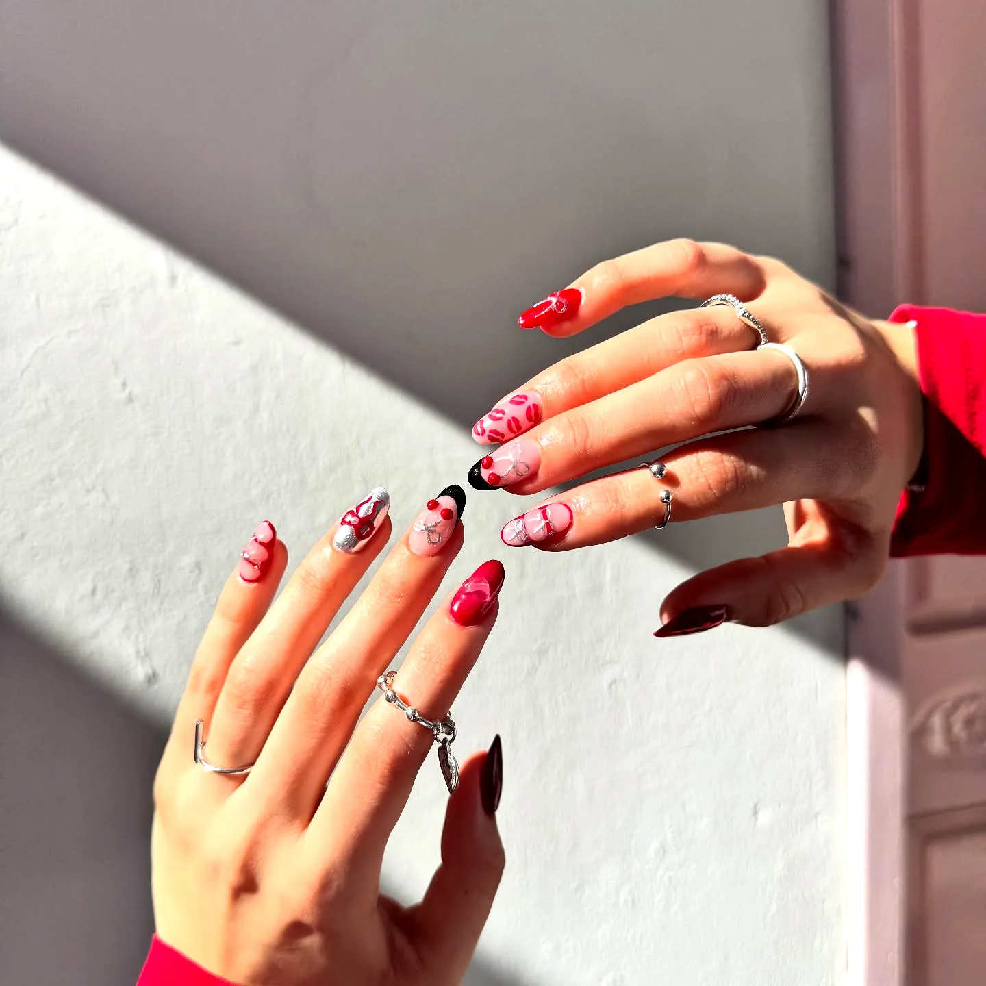 Cute Romantic Valentines Day Nails in Almond and Stiletto Shapes with Fun Heart and Polka Dot Art
