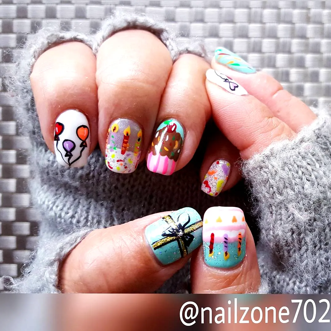 Cute rounded birthday cake nails with colorful balloons candles and gift box in vibrant and pastel colors