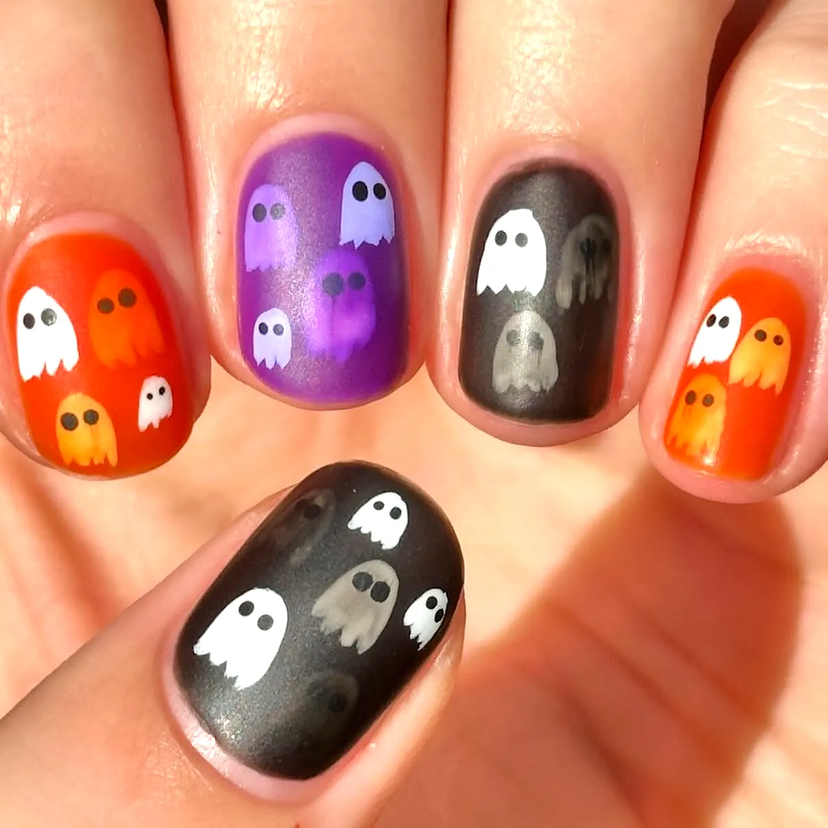 Cute Rounded Halloween Nails for Kids with Ghost Illustrations in Orange Purple and Black Matte Finishes