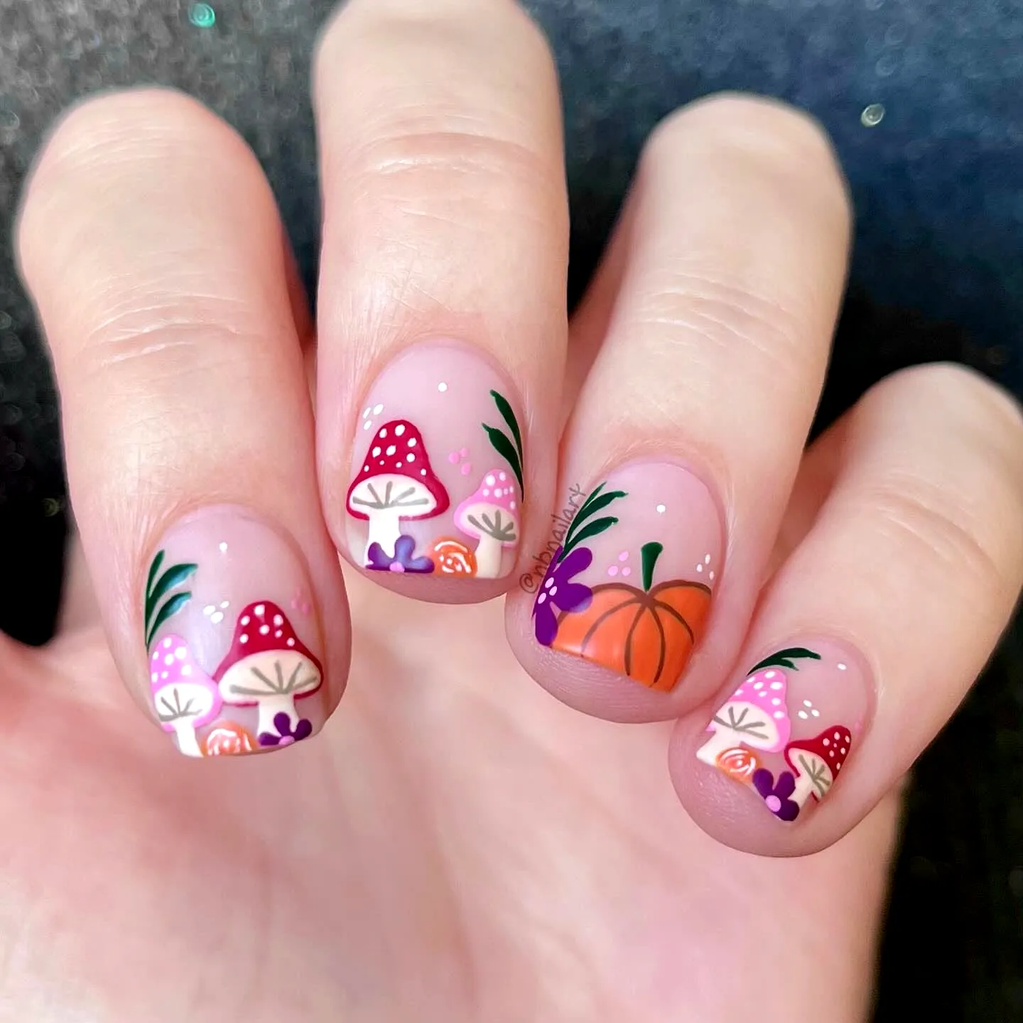 Cute Short Round Pumpkin Nails with Colorful Mushroom and Flower Art on a Glittery Nude Base