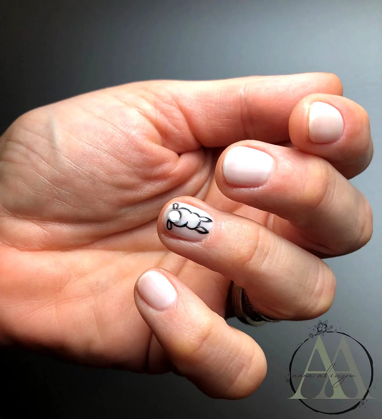 Cute short rounded pale pink Easter nail designs with minimalist bunny art
