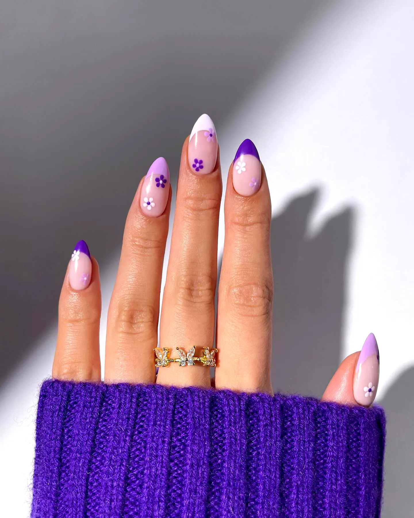 Cute stiletto purple spring nails with lavender gradient and floral designs