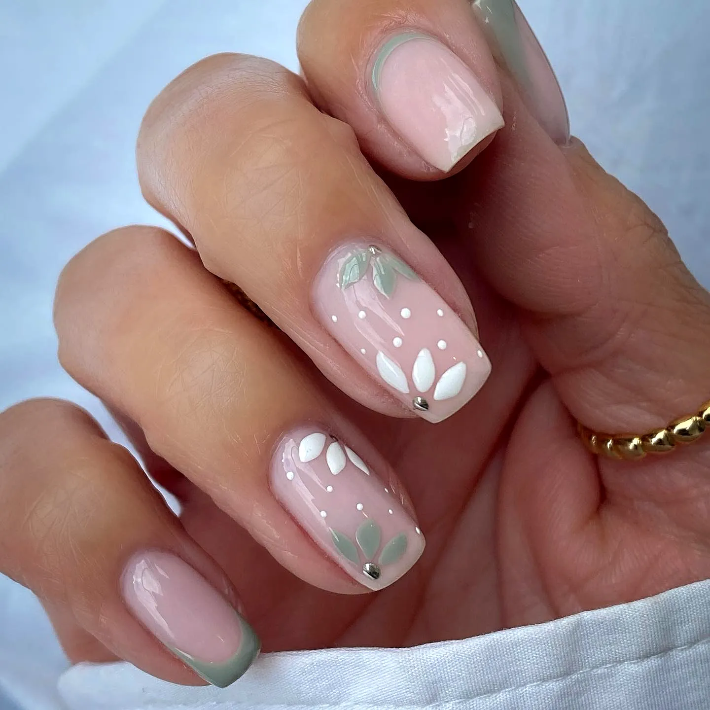 Cute Tulip Nail Designs in Soft Pink with Subtle French Tips and Elegant Floral Patterns