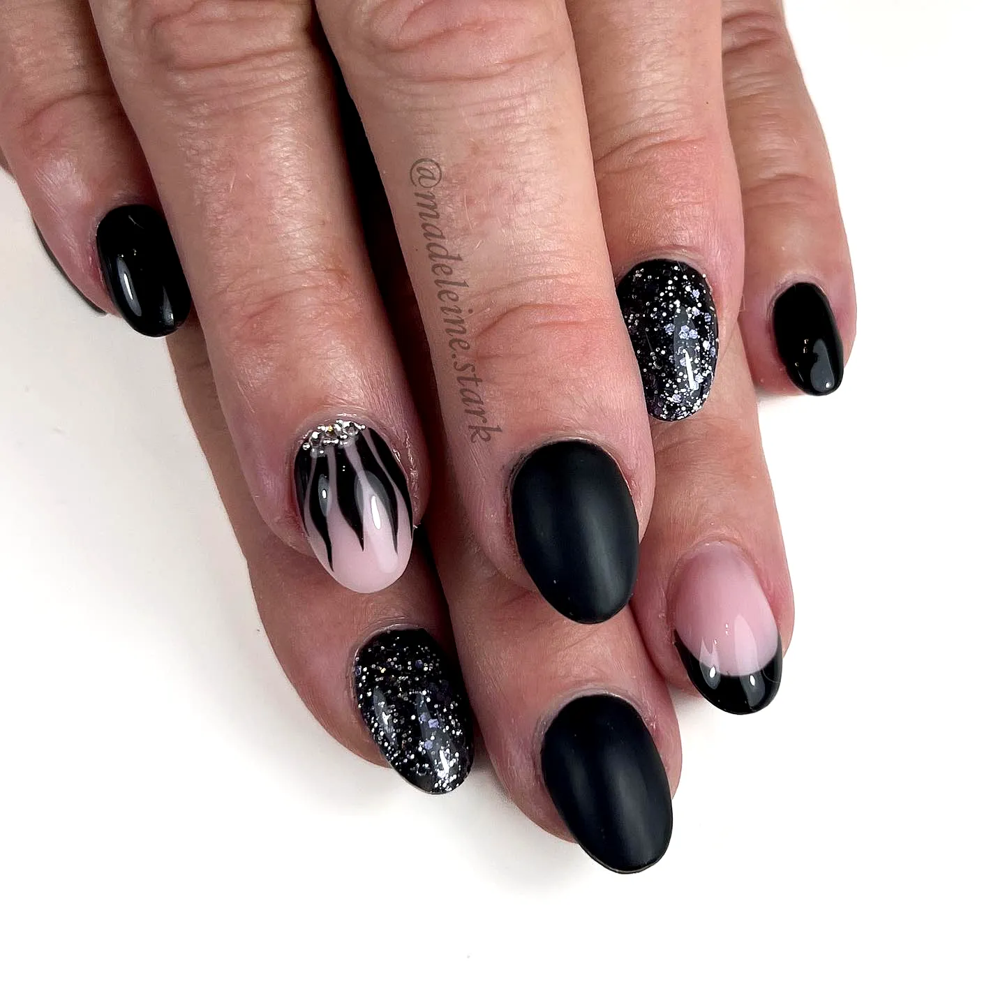 Elegant Almond Black Birthday Nails with Glossy and Matte Finish and Glittery Accents