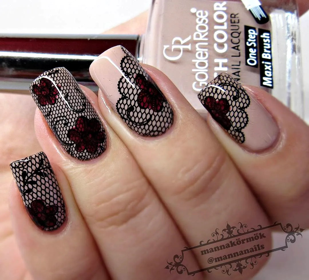 Elegant almond lace nails with nude base and deep red floral accents