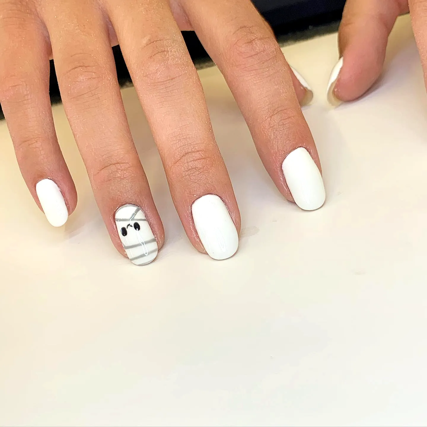 Elegant Almond Mummy Nails in Glossy White with Minimalist Checkered Art