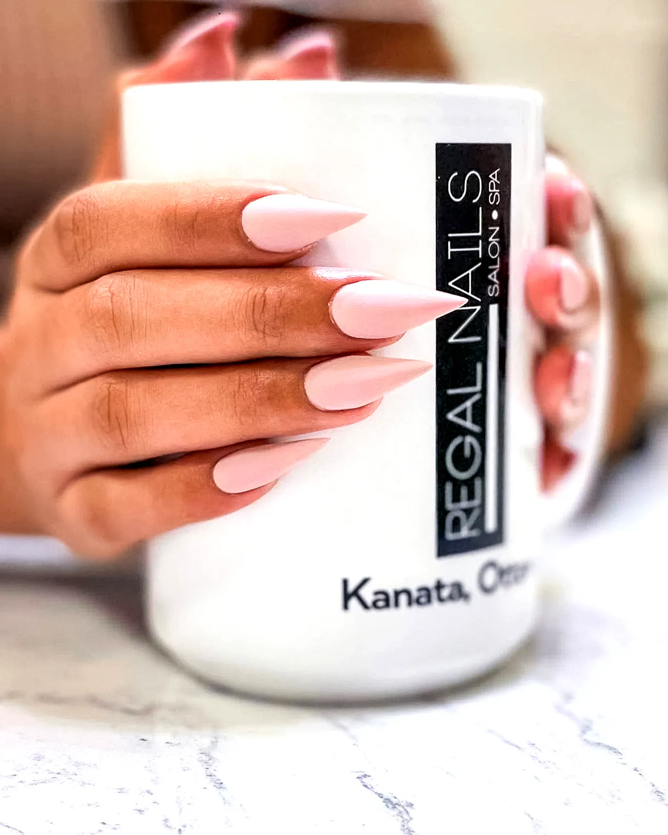 Elegant Almond-Shaped Arrowhead Nails in Soft Muted Pink with Minimalist Style